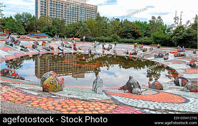 On the shore of a small pond among the houses is located the sculpture of a fish decorated with mosaics. The waterfront lined with beautiful ceramic tiles