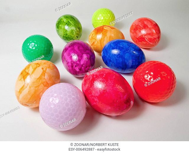 foreign eggs - golf balls between colored eggs