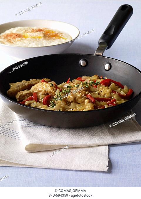 Turkey Scallopini in a Skillet, Bowl of Grits