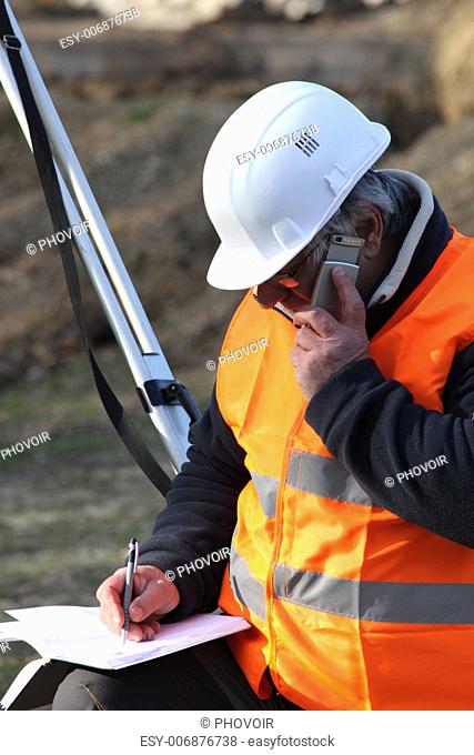 surveyor talking on the phone