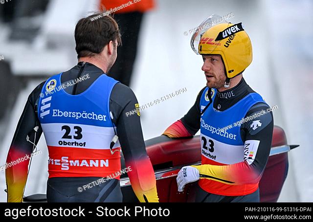 16 January 2021, Thuringia, Oberhof: Luge, World Cup, doubles men, second run. Tobias Wendl (l) and Tobias Arlt from Germany react at the finish