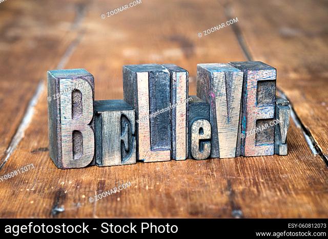 believe exclamation made from wooden letterpress type on grunge wood