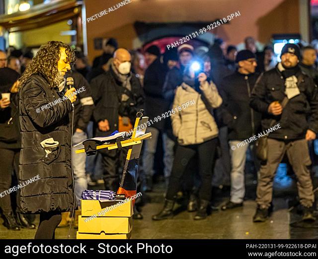 31 January 2022, Brandenburg, Cottbus: Katja Arnold, physiotherapist from Cottbus, speaks to the participants of a demonstration against the Corona policy