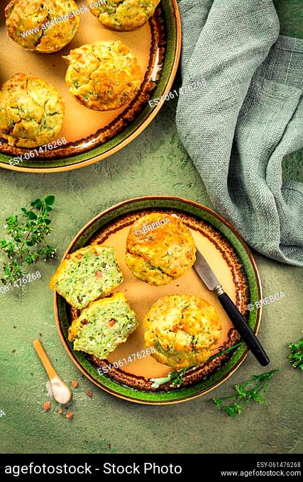Homemade savory zucchini muffins with herbs, feta cheese and bacon