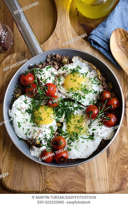 Braised eggs with minced lamb meat, tahini and sumac