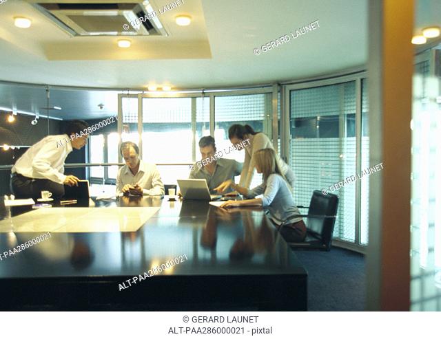 Businesspeople working in conference room