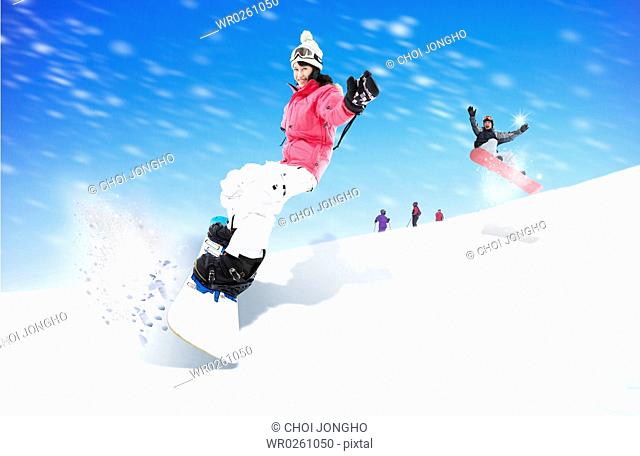 people are snow boarding
