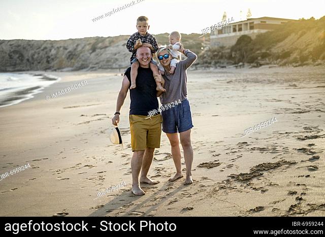 The family with two small boys enjoying the beach, Algarve, Portugal, Europe
