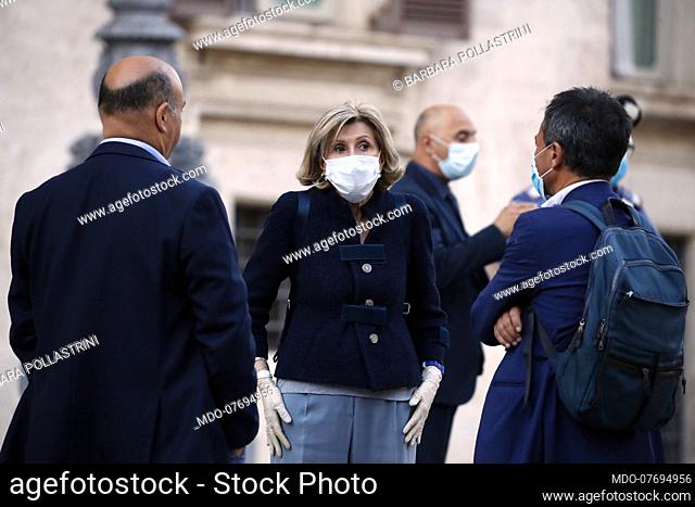Democratic Party MP Barbara Pollastrini with protective mask and gloves on leaving the Chamber of Deputies for the vote of confidence in the Corporate Liquidity...