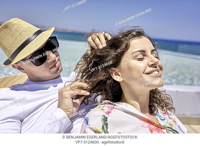 lovers, man caressing hair of woman, holiday, summer, couple, pool, Stock  Photo, Picture And Rights Managed Image. Pic. VP7-3124601 | agefotostock