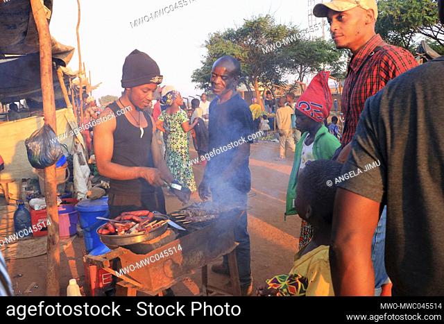 Food vendors are seen preparing food at sunset at Dzaleka Refugge camp, 40 kilometres from the capital city Lilongwe, Malawi