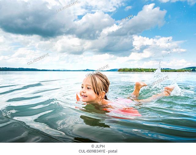 Girl swimming in lake