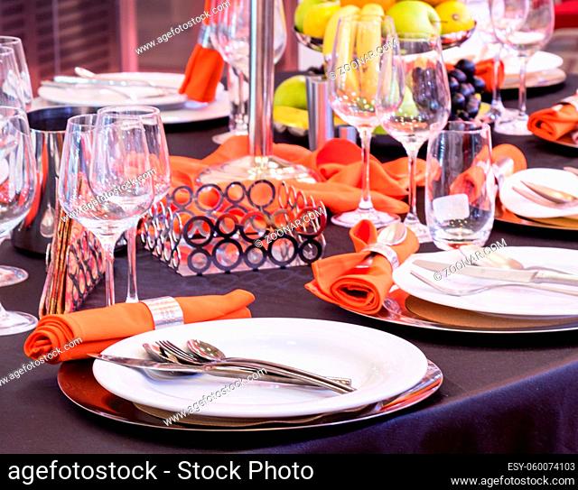 stylish business table arrangement with porcelain and silverware