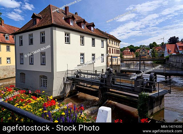 view from the geyerswörthbrücke to the cutting mill and vogtherrsche mühle on the regnitz in the unesco world heritage city of bamberg, upper franconia