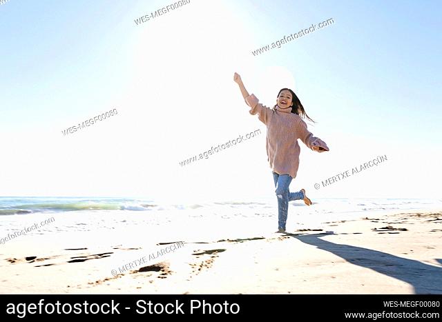 Happy girl having fun at beach