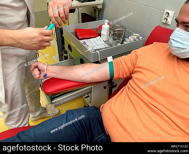 Close up nurse hand collecting blood sample for diagnosis covid-19, Coronavirus.Laboratory technician taking blood for blood chemistry diagnosis by automatic...