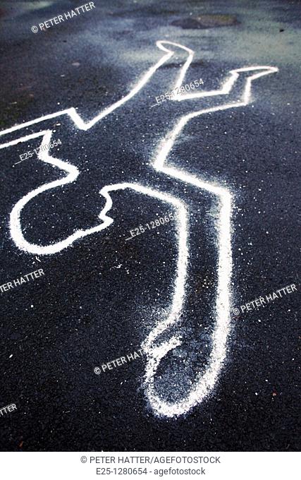 A chalk outline of a body on the ground as if at a crime scene