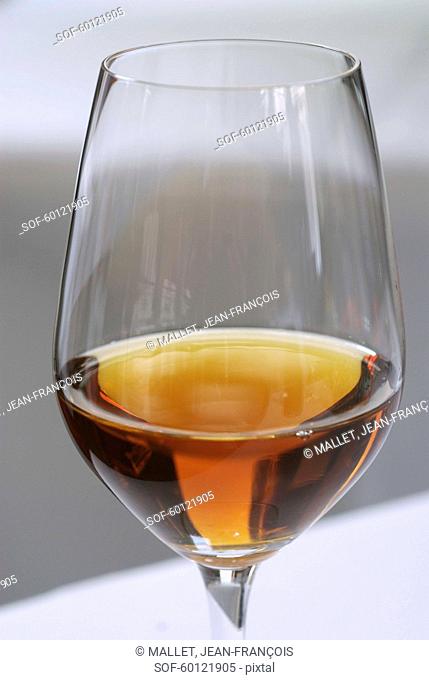 Glass of syrupy white wine