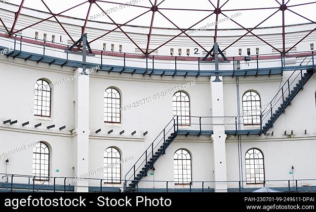 30 June 2023, Saxony, Leipzig: Stairs and walkways of an old gasometer in the south of the city. The 14-meter-high and nearly 45-meter-wide building from around...