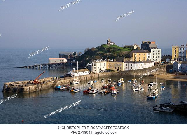 UK, Wales, Pembrokeshire, Tenby, colourful buildings around the harbour in autumn sunshine