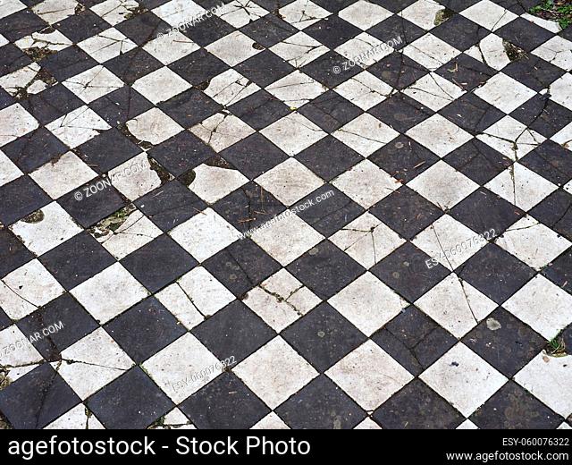 Vintage black and white checkered floor useful as a background