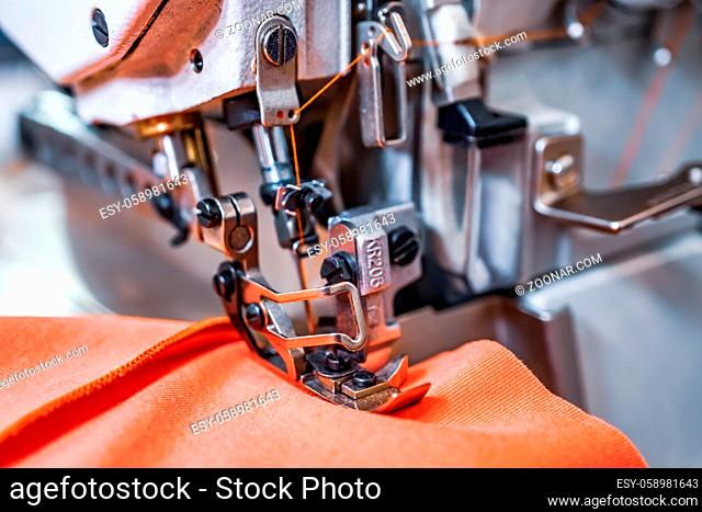 Professional sewing machine close-up. Modern textile industry