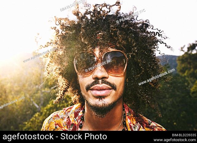 Portrait of Mixed Race man wearing sunglasses