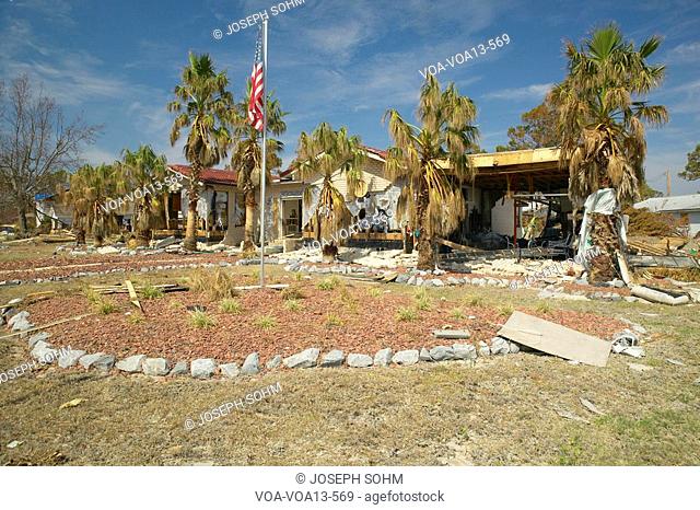 Debris in front of house heavily hit by Hurricane Ivan in Pensacola Florida