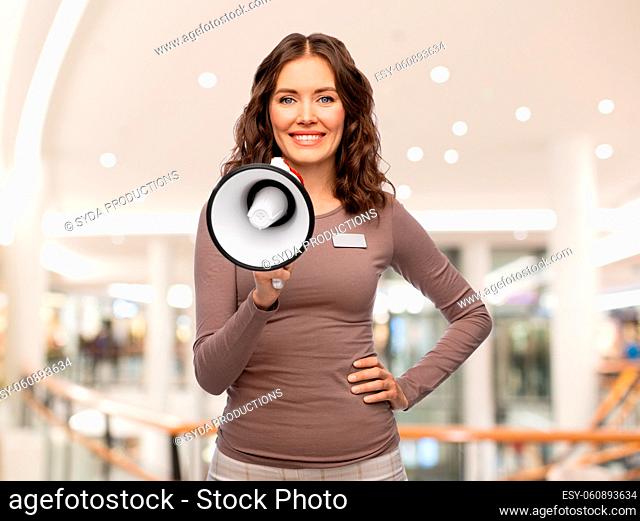 female shop assistant with megaphone at mall