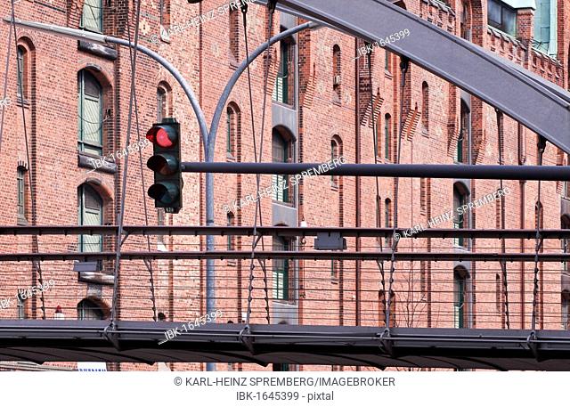 Pedestrian bridge with traffic lights in the Speicherstadt historic warehouse district in Hamburg, Germany, Europe