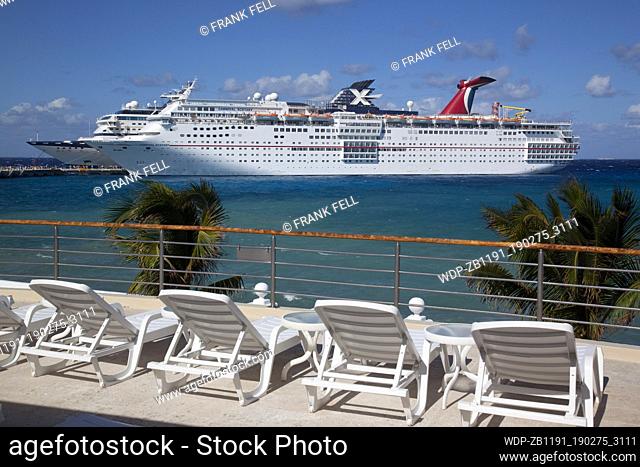 Mexico, Quintana Roo, Cozumel Island, Cruise Ship in Port & Sun Loungers
