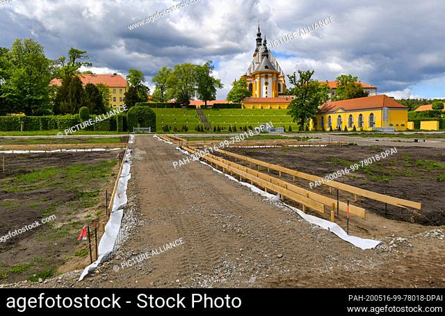 12 May 2020, Brandenburg, Neuzelle: The construction site of the extension of the monastery garden with the catholic church in the background