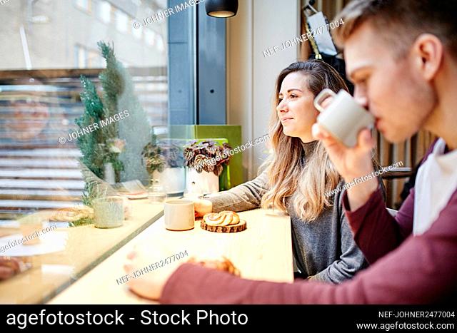 Woman in cafe having coffee
