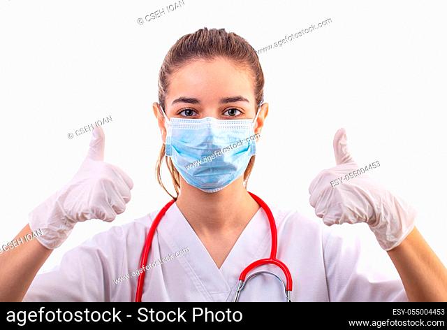 Young woman medical professional nurse or doctor with thumbs up, showing it is everything ok