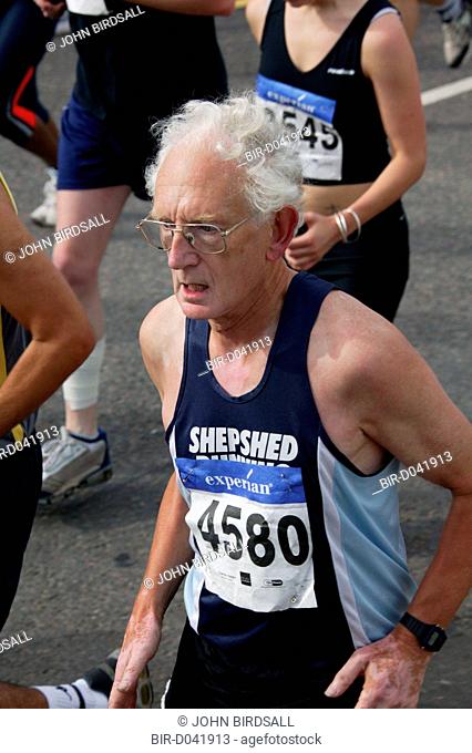 Older man running runner in the Nottingham Robin Hood Marathon, held every year and starting and finishing at the Victoria Embankment