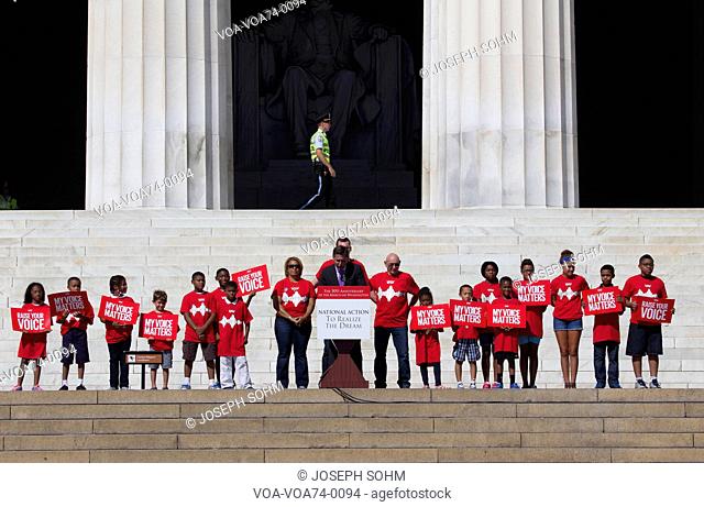 Children in red shirts for My Voice Matter at the National Action to Realize the Dream march and rally for the 50th Anniversary of the march on Washington and...