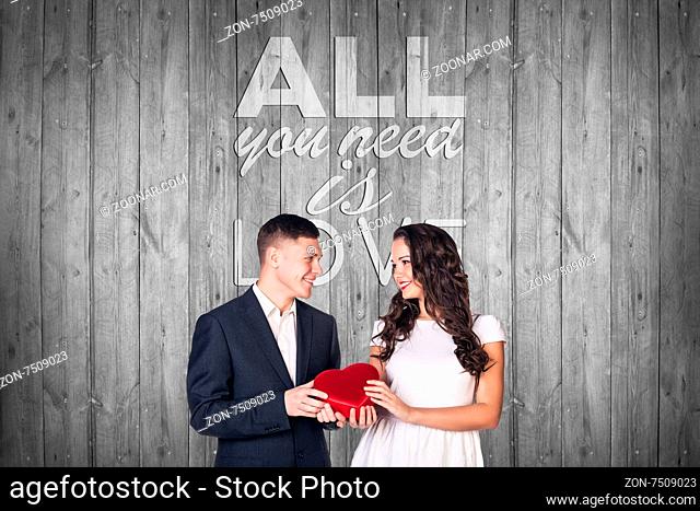 Beautiful man and woman on gray background with text all you need is love