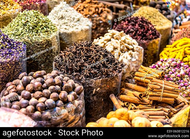 Variety of spices and herbs on the arab street market stall. Dubai Spice Souk, United Arab Emirates