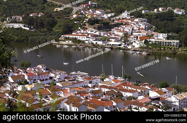 View of spanish Sanlucar and Portuguese Alcoutim towns divided by the Guadiana river
