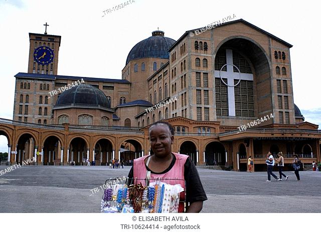 Aparecida Brazil Sao Paulo State Basilica Of The National Shrine Of Our Lady Of Aparecida Woman Selling Rosarys Outside The Basilica
