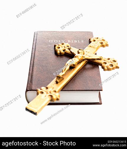 The holy bible and crucifix isolated on a white background