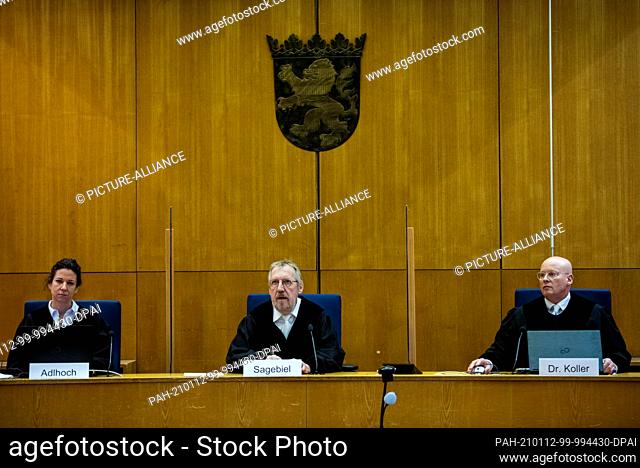 12 January 2021, Hessen, Frankfurt/Main: Presiding Judge Thomas Sagebiel (M) sits between Associate Judges Miriam Adlhoch (l) and Christoph Koller at his seat...