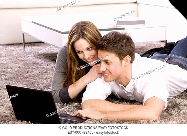 Couple with laptop computer