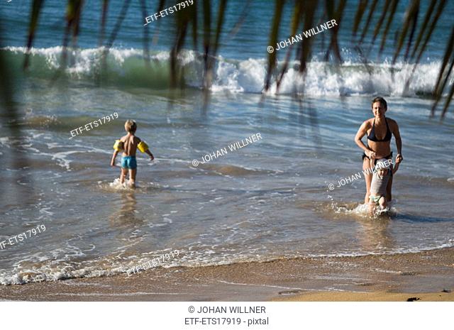 Woman and children bathing in the sea, Guadeloupe
