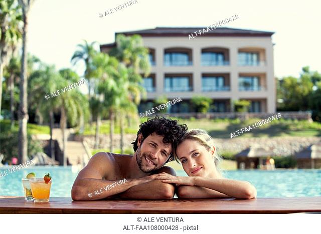 Couple relaxing together in resort pool