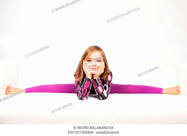 Cute little girl making splits