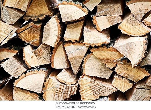 Dry chopped firewood logs in pile