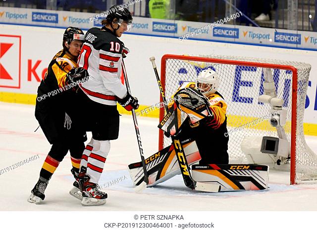 L-R Taro Jentzsch (GER), Raphael Lavoi (CAN) and Hendrik Hane (GER) in action during the 2020 IIHF World Junior Ice Hockey Championships Group B match between...