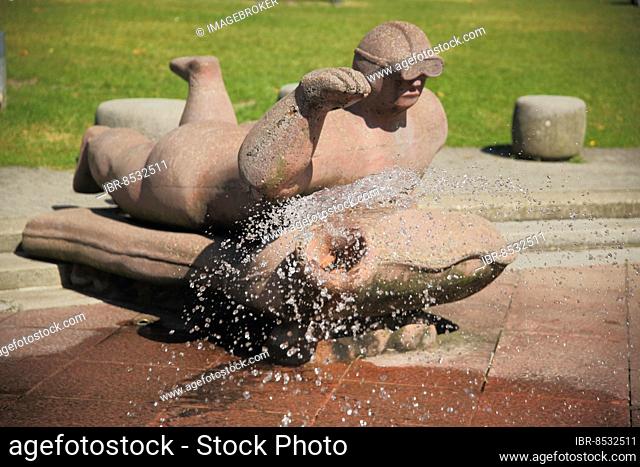 Sculpture at the ornamental fountain water spray field, diver, figure, red, dive, water features, Günthersburgpark, Bornheim, Main, Frankfurt, Hesse, Germany