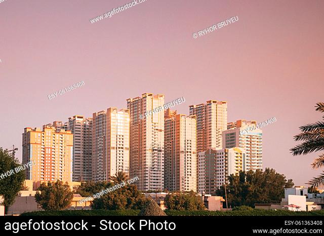 New Residential Multi-storey Houses. Cityscape Skyline In Sunny Spring Evening On Pink Sky. Real Estate, Development Industry. UAE